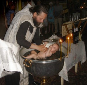 Infant baptism by immersion